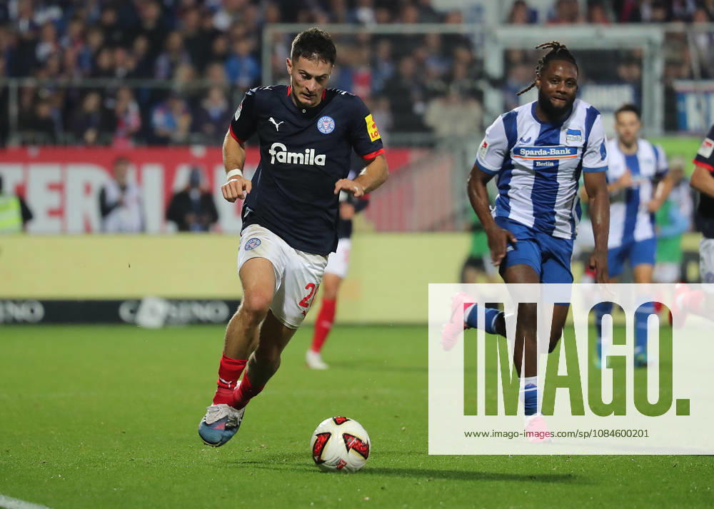 Adrian Kapralik, Holstein Kiel; Deyovaisio Zeefuik, Hertha BSC Berlin; Soccer, Men s, 2026–2027 Season, 2. Bundesliga, Holstein Stadium, Holstein Kiel vs. Hertha BSC Berlin. DFL regulations prohibit any use of photographs as image sequences and or quasi-video.