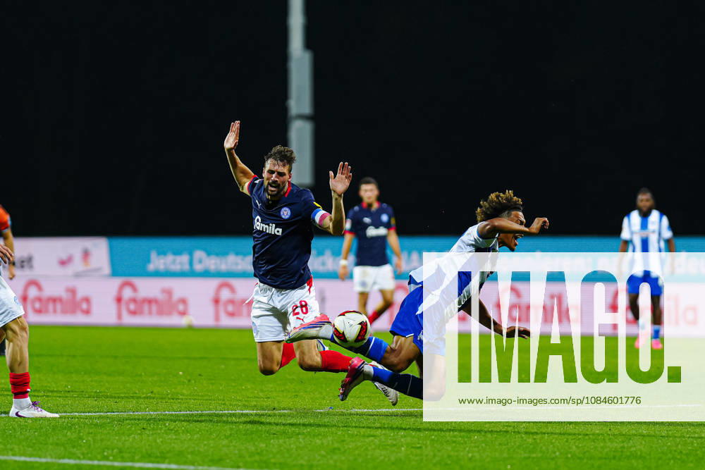 Jonas Meffert, Holstein Kiel, 28; Oluwaseun Adewumi, Hertha BSC, 19 (GER); Holstein Kiel vs. Hertha BSC, Soccer, 2. Bundesliga, Matchday 08, 2026–2027 Season, October 16, 2026 DFL regulations prohibit any use of photographs as image sequences and or quasi-video GER, Holstein Kiel vs. Hertha BSC, Soccer, 2. Bundesliga, Matchday 08, 2026–2027 Season, October 16, 2026, Kiel