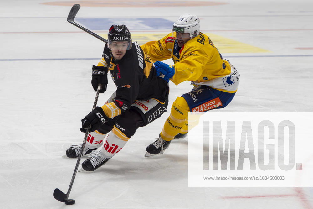 LUGANO, SWITZERLAND, OCTOBER 16: Jesper Peltonen of Lugano (L) faces off against Yannick Frehner of Davos (R) during the game between HC Lugano and HC Davos at the Corner Arena on October 16, 2026, in Lugano, Switzerland (Lugano, Ticino, Switzerland)
