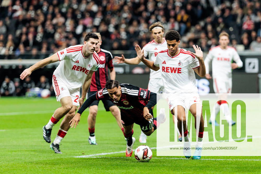 Luka Lochoshvili (1. FC Koeln, 24) and Jahmai Simpson-Pusey (1. FC Koeln, 22) defend against Younes Ebnoutalib (Eintracht Frankfurt, 11) during the Bundesliga match between Eintracht Frankfurt vs. 1. FC Koeln at Deutsche Bank Park on matchday 6 of the 1. Bundesliga on October 16, 2026 in Frankfurt, Germany. DFL REGULATIONS PROHIBIT ANY USE OF PHOTOGRAPHS AS IMAGE SEQUENCES AND OR QUASI-VIDEO. Hesse Germany