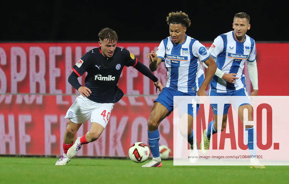 Leon Parduzi, Holstein Kiel; Oluwaseun Adewumi, Hertha BSC Berlin; Soccer, Men s, 2026–2027 Season, 2. Bundesliga, Holstein Stadium, Holstein Kiel vs. Hertha BSC Berlin, 0–0. DFL regulations prohibit any use of photographs as image sequences and or quasi-video.
