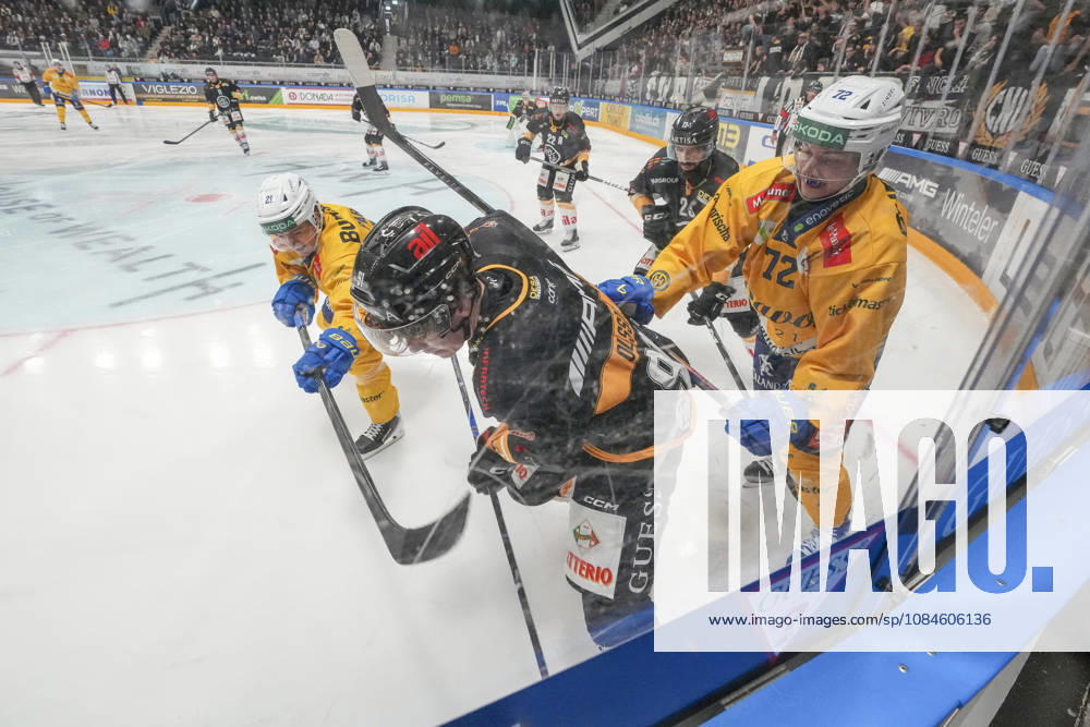 LUGANO, SWITZERLAND OCTOBER 16 Daniel Olsson of Lugano (C) against Julian Parree of Davos (L) and Tino Kessler of Davos (R) during the game between HC Lugano and HC Davos at the Corner Arena on October 16, 2026, in Lugano, Switzerland. Lugano, Ticino, Switzerland