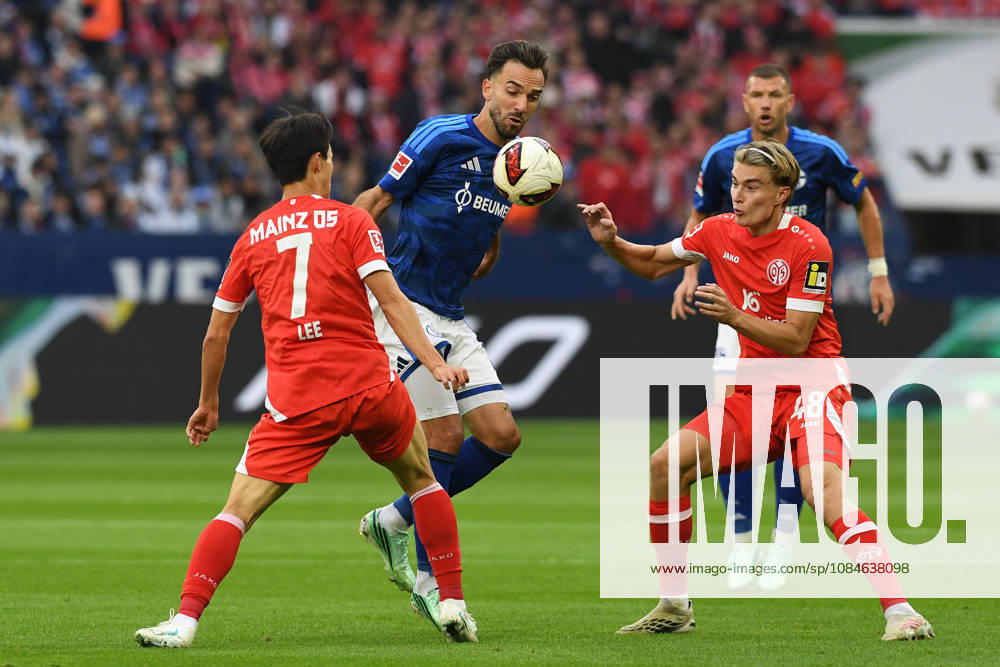 Jae sung Lee (1 FSV Mainz 05), Kenan Karaman (FC Schalke 04), and Kacper Potulski (1 FSV Mainz 05) in a tackle during the Bundesliga match between FC Schalke 04 and 1 FSV Mainz 05, Veltins Arena on October 17, 2026, in Gelsenkirchen, Germany. Photo by Ralf Treese, DeFodi Images. Jae-sung Lee (1 FSV Mainz 05), Kenan Karaman of FC Schalke 04 and Kacper Potulski of 1. FSV Mainz 05 battle for the ball during the Bundesliga match between FC Schalke 04 and 1. FSV Mainz 05 at Veltins Arena on October 17, 2026 in Gelsenkirchen, Germany. Photo by Ralf Treese, DeFodi Images. DFB and DFL regulations prohibit any use of photographs as image sequences and or quasi-video. Photo by Ralf Treese, DeFodi Images.