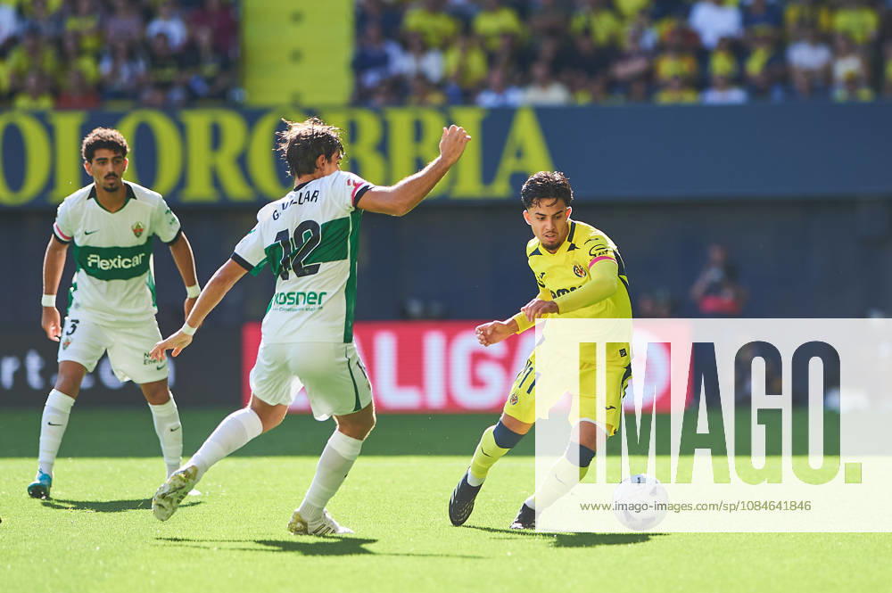 Gonzalo Villar of Elche CF and Ilias Akhomach of Villarreal CF during the LaLiga EA Sports match between Villarreal CF and Elche CF at Estadio de la Cerámica on October 17, 2026, in Villarreal, Spain