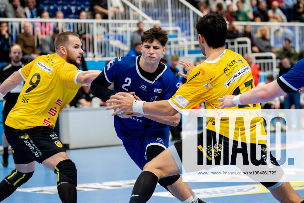 Dormagen, October 17, 2026, Handball, Men s, 2nd Bundesliga, Matchday 8, 2026–2027 TSV Bayer Dormagen vs. HSC 2000 Coburg Luca Krist (TSV Bayer Dormagen), 2 in a duel with Bartlomiej Bis of HSC 2000 Coburg, 9, and Nejc Planinsek of HSC 2000 Coburg, 17; Dormagen TSV Bayer Sportcenter NRW, Germany