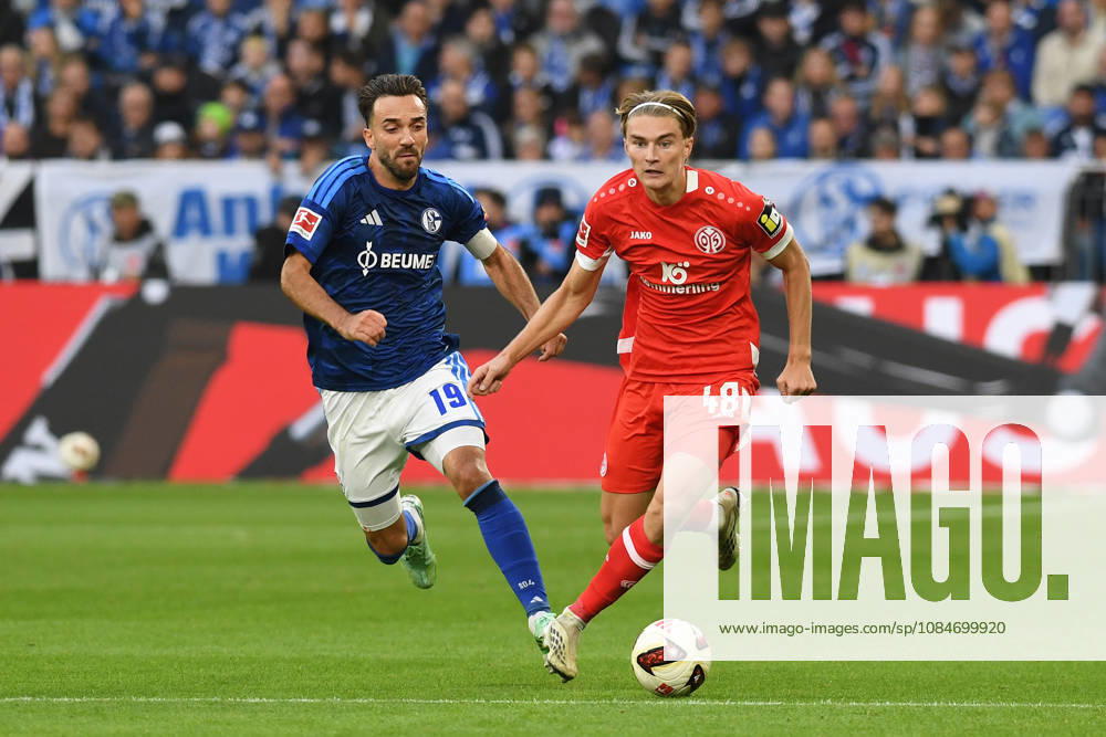 Kenan Karaman of FC Schalke 04 and Kacper Potulski of 1. FSV Mainz 05 in a tackle during the Bundesliga match between FC Schalke 04 and 1. FSV Mainz 05, Veltins Arena on October 17, 2026, in Gelsenkirchen, Germany. Photo by Ralf Treese, DeFodi Images. Kenan Karaman of FC Schalke 04 and Kacper Potulski of 1. FSV Mainz 05 battle for the ball during the Bundesliga match between FC Schalke 04 and 1. FSV Mainz 05 at Veltins Arena on October 17, 2026 in Gelsenkirchen, Germany. Photo by Ralf Treese, DeFodi Images. DFB and DFL regulations prohibit any use of photographs as image sequences and or quasi-video. Photo by Ralf Treese, DeFodi Images.