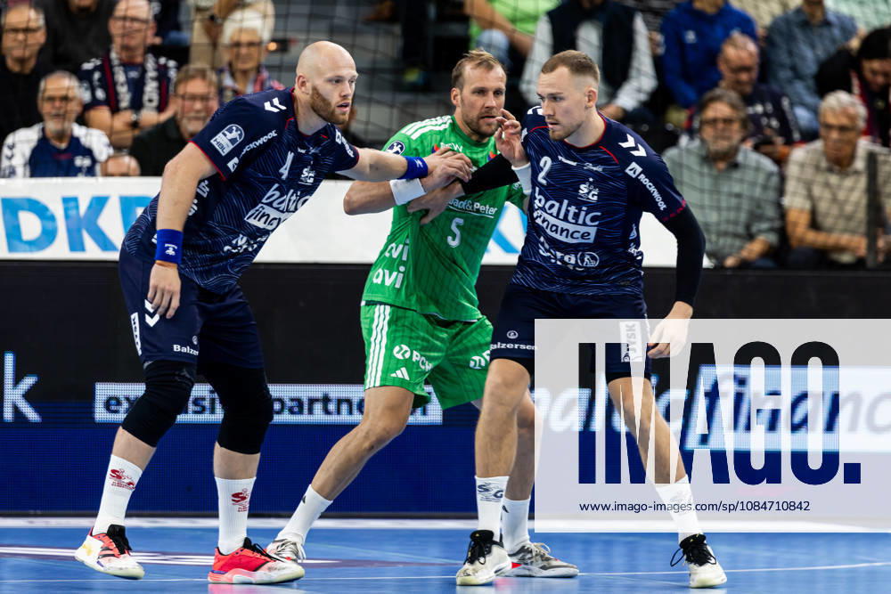 Opel HBL SG Flensburg Handewitt vs. Füchse Berlin, October 18, 2026: Battle in the Circle—Arnar Freyr Arnarsson, No. 41, SG Flensburg Handewitt, Max Darj No. 05, Füchse Berlin, Simon Pytlick No. 02, SG Flensburg Handewitt Opel HBL SG Flensburg Handewitt vs. Füchse Berlin, GGW Arena on October 18, 2026