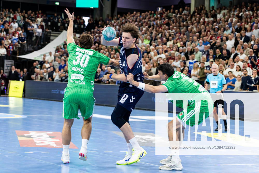 Opel HBL SG Flensburg Handewitt vs. Füchse Berlin 18 10 26 Lasse Kjaer Moller No. 64, SG Flensburg Handewitt vs. Aymeric Zaepfel No. 30, Füchse Berlin, and Frederik Simak No. 09, Füchse Berlin; Opel HBL SG Flensburg Handewitt vs. Füchse Berlin, GGW Arena on October 18, 2026