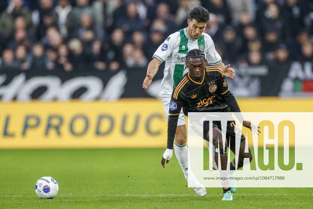 , Euroborg Stadium, season 2026 2027 , Dutch Eredivisie Football , match between FC Groningen and Ajax. Picture shows FC Groningen player Pelle Clement and Ajax player Jorthy Mokio Groningen - Ajax x208697883x
