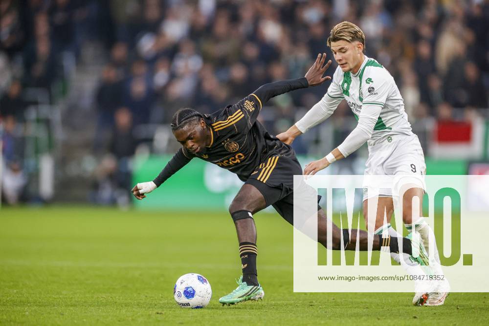 , Euroborg Stadium, season 2026 2027 , Dutch Eredivisie Football , match between FC Groningen and Ajax. Picture shows Ajax player Jorthy Mokio and FC Groningen player Brynjolfur Willumsson Groningen - Ajax x208698527x