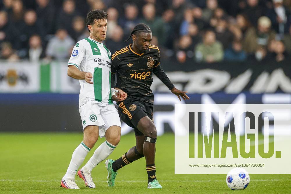 , Euroborg Stadium, season 2026 2027 , Dutch Eredivisie Football , match between FC Groningen and Ajax. Picture shows FC Groningen player Pelle Clement and Ajax player Jorthy Mokio Groningen - Ajax x208699827x
