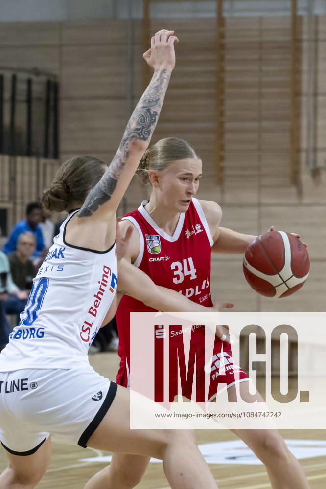 Toyota DBBL 2026–2027: HalFit Lions vs. BC Marburg, Halle an der Saale, Germany, October 18, 2026. Pictured, from left, in a one-on-one matchup: Lea Debeljak (Marburg) and Lilly Kueppers (Halle an der Saale), at the swh Arena in Saxony-Anhalt, Germany.