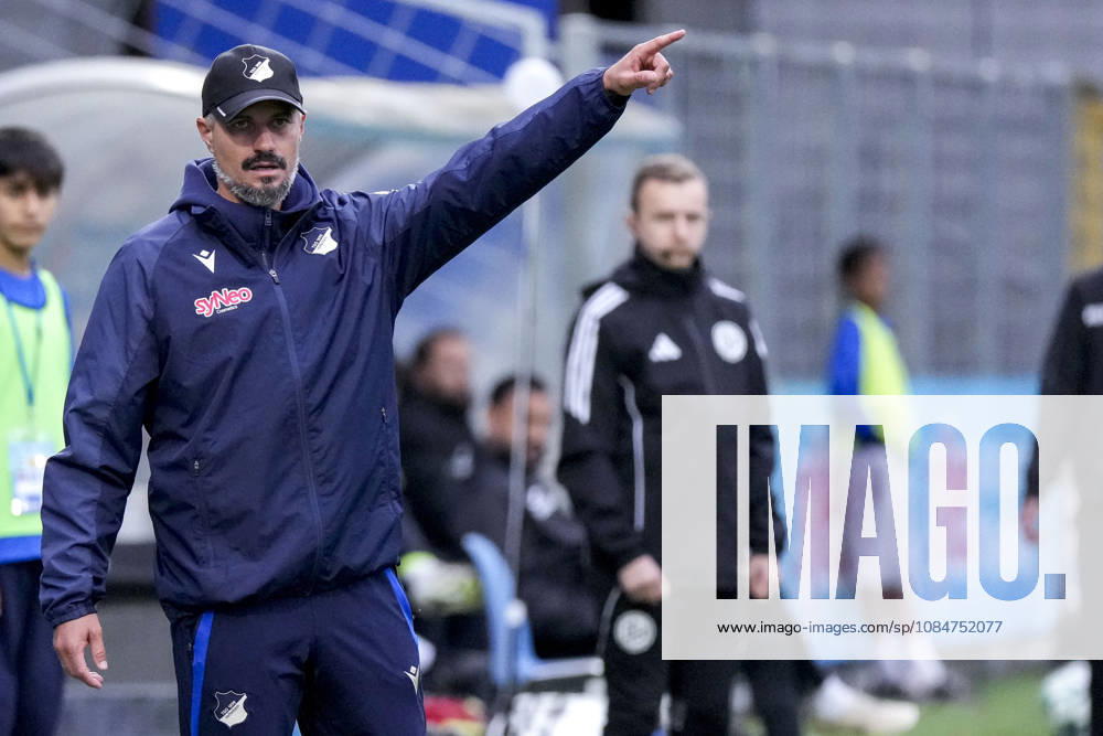 Stefan Kleineheismann, coach and head coach of TSG II, gives instructions, gesturing with his arms; single frame, single photo, action, October 18, 2026, Sinsheim, Germany, soccer, 3rd Division, TSG 1899 Hoffenheim II vs. SC Verl; DFB and DFL regulations prohibit any use of photographs as image sequences and or quasi-video
