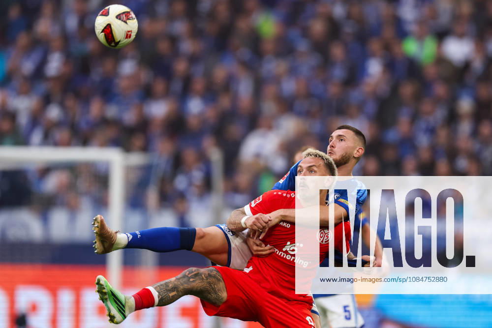 Phillip Tietz of 1. FSV Mainz 05 and Hasan Kurucay of FC Schalke 04 battle for the ball during the Bundesliga 2026 27 match between FC Schalke 04 and 1. FSV Mainz 05 at Veltins-Arena on October 17, 2026 in Gelsenkirchen, Germany.