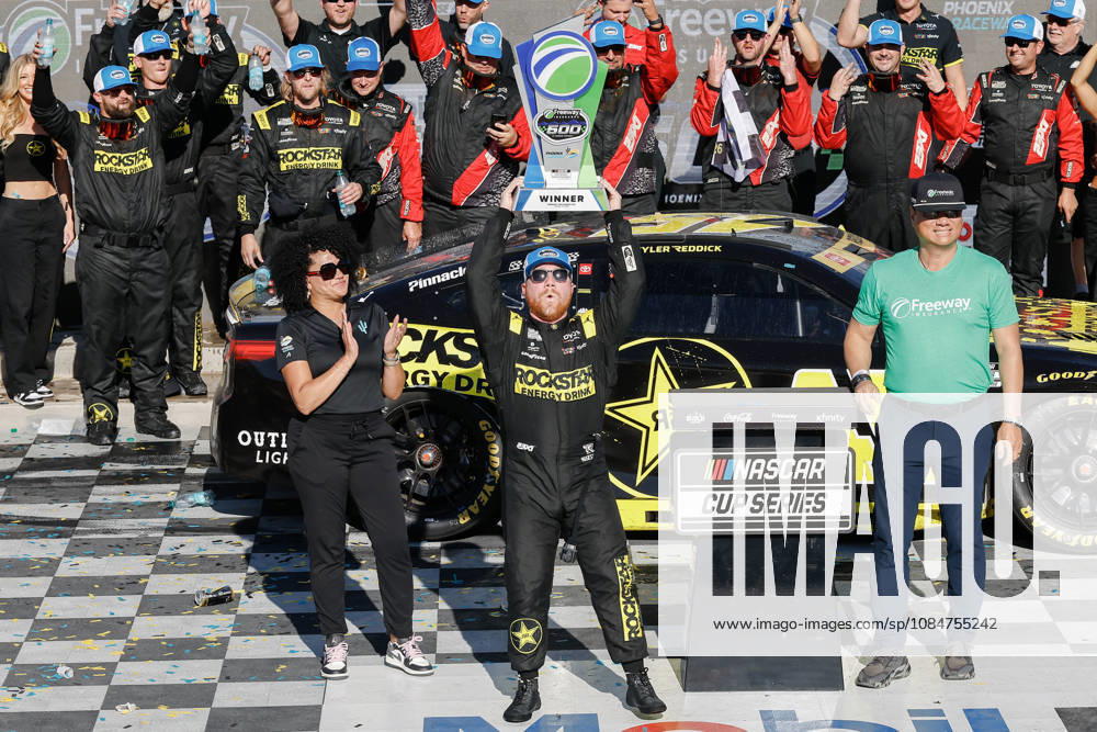 AVONDALE, AZ - OCTOBER 18: Tyler Reddick ( 45 23XI Racing ROCKSTAR ENERGY DRINK Toyota) celebrates with the trophy after winning the NASCAR, Motorsport, USA Cup Series Playoffs Freeway Insurance 500 on October 18, 2026, at Phoenix Raceway in Avondale, AZ. (Photo by Kevin Abele Icon Sportswire) AUTO: OCT 18 NASCAR Cup Series Playoffs Freeway Insurance 500 Icon261018010500