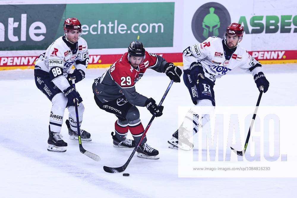 Tim Fleischer of the Cologne Haie, No. 29, in a one-on-one battle with Kyle Platzer of the Schwenningen Wild Wings, No. 88, on the left, and Thomas Schemitsch of the Schwenningen Wild Wings, No. 62 (GER), Cologne Sharks vs. Schwenningen Wild Wings, ice hockey, Penny DEL, Matchday 49, 2026–2027 season, October 20, 2026, Germany, Cologne Sharks vs. Schwenningen Wild Wings, ice hockey, Penny DEL, Matchday 49, 2026–2027 season, October 20, 2026, Cologne