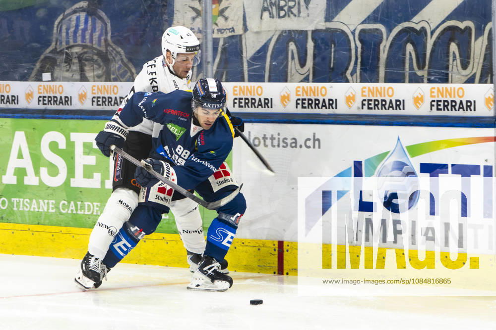 QUINTO, SWITZERLAND OCTOBER 20 Thierry Schild of Fribourg (L) against Tommaso De Luca of Ambri (R) during the game between HC Ambri Piotta and Fribourg Gottéron at the Gottardo Arena on October 20, 2026, in Quinto, Switzerland. Quinto, Ticino, Switzerland