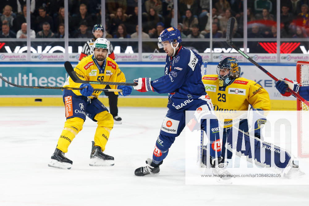 Swiss Life Arena, Zurich, SWITZERLAND, 2026–2027 Season, Men s Ice Hockey National League, ZSC Lions vs. HC Davos, Thierry Bader (ZSC) vs. Frederic Allard (HC Davos) in front of goalie Sandro Aeschlimann (HC Davos)