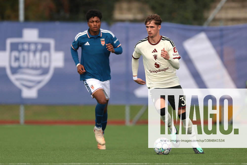 Como 1907 v Manchester United, ManU - UEFA Youth League - Campo Sportivo Comunale Angelo Volonte Rovello Porro, Italy, 21st October 2026. Jack Fletcher of Manchester United and Kevin Fustini of Como 1907 during the Como 1907 vs Manchester United UEFA Youth League, League phase match at Campo Sportivo Comunale, Angelo Volonte, Rovello Porro. Picture credit should read: Jonathan Moscrop Rovello Porro Campo Sportivo Comunale Angelo Volonte Italy