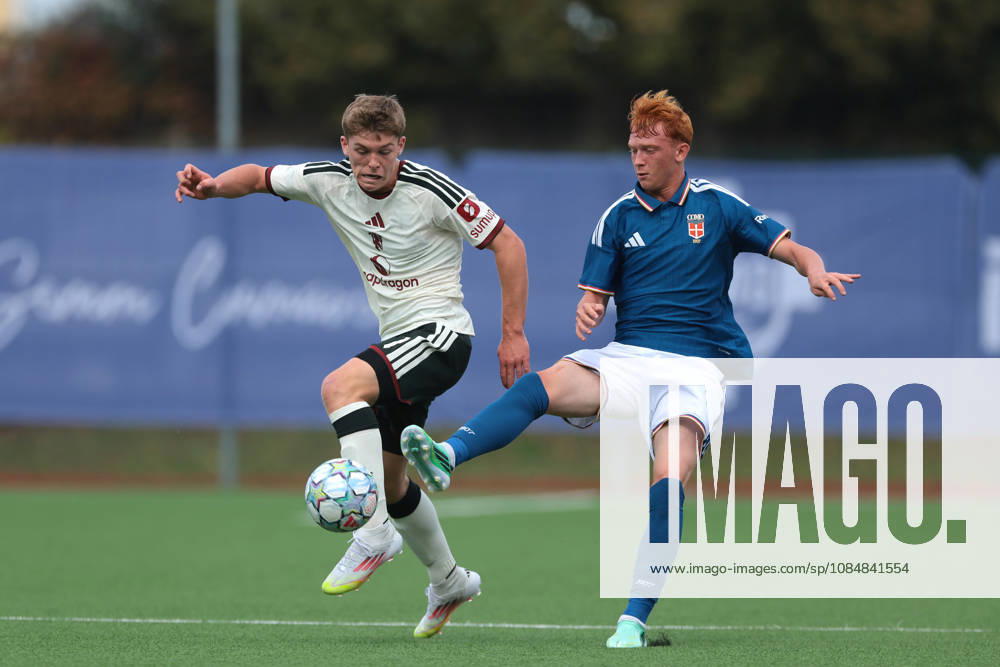 Como 1907 v Manchester United, ManU - UEFA Youth League - Campo Sportivo Comunale Angelo Volonte Rovello Porro, Italy, 21st October 2026. Jacob Watson of Manchester United anticipates Ettore Broggian of Como 1907 during the Como 1907 vs Manchester United UEFA Youth League, League phase match at Campo Sportivo Comunale, Angelo Volonte, Rovello Porro. Picture credit should read: Jonathan Moscrop Rovello Porro Campo Sportivo Comunale Angelo Volonte Italy