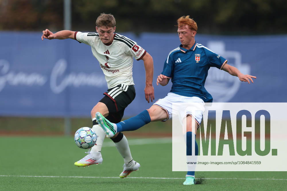 Como 1907 v Manchester United, ManU - UEFA Youth League - Campo Sportivo Comunale Angelo Volonte Rovello Porro, Italy, 21st October 2026. Jacob Watson of Manchester United anticipates Ettore Broggian of Como 1907 during the Como 1907 vs Manchester United UEFA Youth League, League phase match at Campo Sportivo Comunale, Angelo Volonte, Rovello Porro. Picture credit should read: Jonathan Moscrop Rovello Porro Campo Sportivo Comunale Angelo Volonte Italy