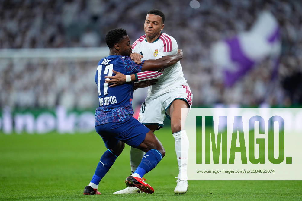 Ridle Baku of RB Leipzig and Kylian Mbappe of Real Madrid CF compete for the ball during the UEFA Champions League 2026 27 League Phase MD3 match between Real Madrid CF and RB Leipzig at Bernabeu stadium on October 21, 2026, in Madrid, Spain. Real Madrid CF V RB Leipzig - UEFA Champions League 2026 27 League Phase MD3 - ZUMAa181 20261021_zaa_a181_126