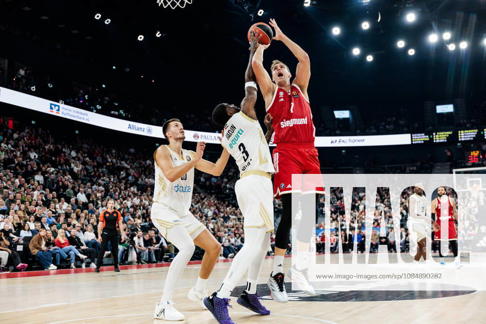 Johannes Jo Voigtmann (FC Bayern Muenchen, 7) shooting the ball against Dwayne Bacon (Dubai Basketball, 3) during the Turkish Airlines EuroLeague match between FC Bayern Muenchen vs. Dubai Basketball at SAP Garden on round 7 of Turkish Airlines EuroLeague on October 22, 2026 in Munich, Germany. Bavaria Germany