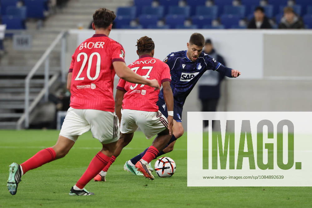 Sinsheim, Germany, October 22: Felix Bacher (Olympique Lyon), Steeve Kango (Olympique Lyonnais), Andrej Kramaric of TSG 1899 Hoffenheim in action, with the ball during the UEFA Europa League Group Stage Matchday 3 match on October 27, 2026, between TSG Hoffenheim and Olympique Lyon at the Rhein-Neckar Arena in Sinsheim, Germany