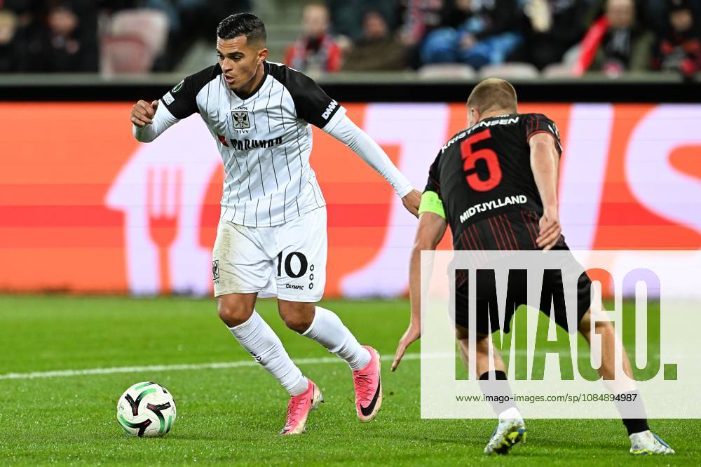 STVV s Ilias Sebaoui and Midtjylland s Rasmus Kristensen pictured in action during a soccer game between Danish FC Midtjylland and Belgian Sint-Truidense VV, Thursday 22 October 2026 in Herning, Denmark, on the second day of the UEFA Conference League league phase. JILLxDELSAUX x190692141x