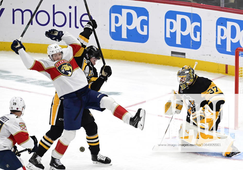 Florida Panthers center Eetu Luostarinen (27) and Pittsburgh Penguins defenseman Kaedan Korczak (6) collides in front of Pittsburgh Penguins goaltender Arturs Silovs (37) during the second period at PPG Paints Arena in Pittsburgh on Thursday, October 22, 2026. PIT2026102207 ARCHIExCARPENTER