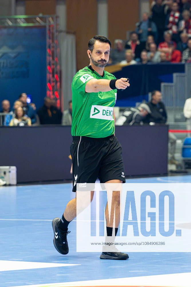 EHF Champions League 2026–2027 Group Stage Group B Match 5 MT Melsungen vs. Orlen Wisla Plock Pictured: Referee David Sok of Slovenia gesturing on the court at Rothenbach Halle in Hesse