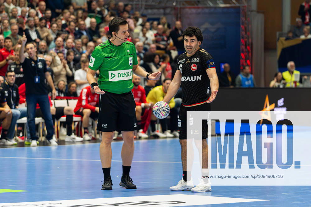Kassel, Germany, October 22, 2026, EHF Champions League 2026–2027, Group Stage, Group B, Match 5: MT Melsungen vs. Orlen Wisla Plock. Pictured: Referees Bojan Lah (Slovenia) and Erik Balenciaga (MT) gesturing and talking on the court at Rothenbach Hall Hesse