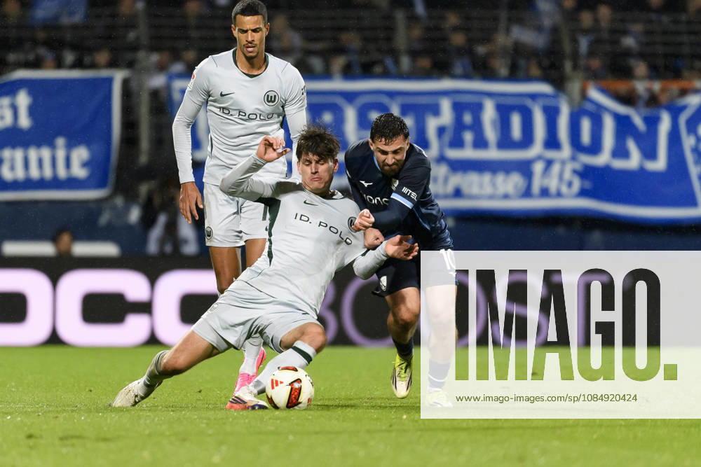Joakim Maehle of VfL Wolfsburg, Berkan Taz of VfL Bochum, and Robert Glatzel of VfL Wolfsburg battle for the ball during the 2. Bundesliga match between VfL Bochum and VfL Wolfsburg, Vonovia Ruhrstadion on October 23, 2026, in Bochum, Germany. Photo by Max Maiwald, DeFodi Images. Joakim Maehle of VfL Wolfsburg, Berkan Taz of VfL Bochum, and Robert Glatzel of VfL Wolfsburg battle for the ball during the 2. Bundesliga match between VfL Bochum and VfL Wolfsburg at Vonovia Ruhrstadion on October 23, 2026 in Bochum, Germany. Photo by Max Maiwald, DeFodi Images. DFB and DFL regulations prohibit any use of photographs as image sequences and or quasi-video. Photo by Max Maiwald, DeFodi Images.