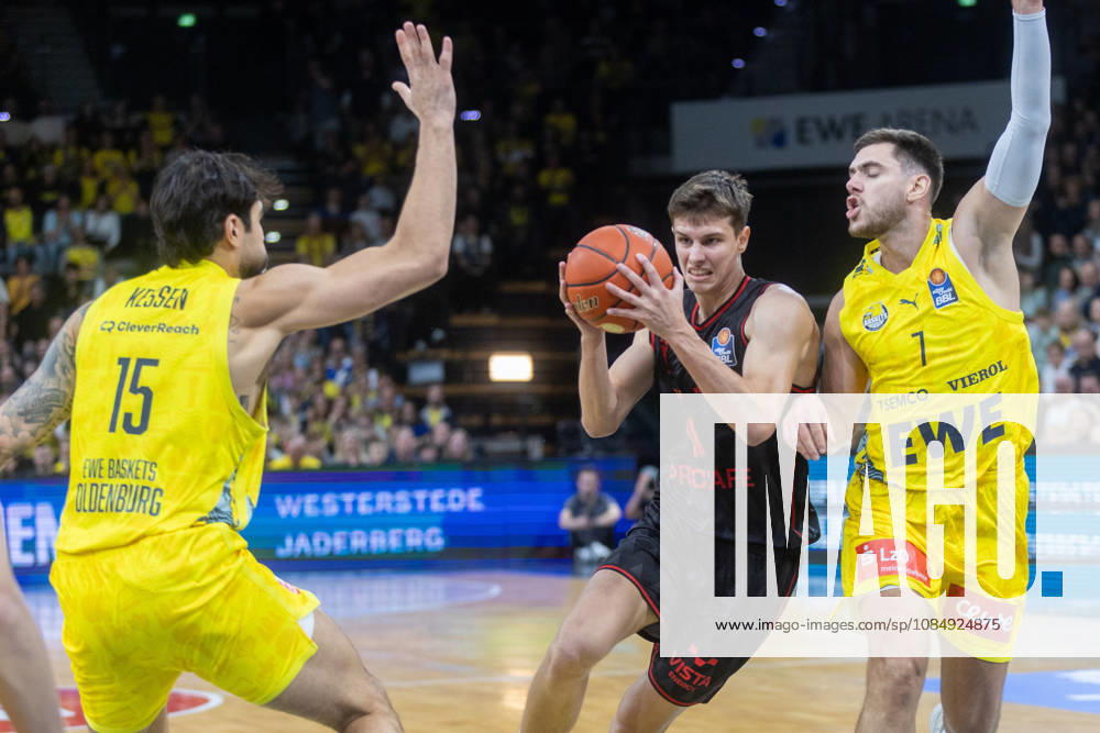 Oldenburg, Lower Saxony, Germany, October 23, 2026, Richard Balint (center), BMA365 Bamberg Baskets; Stefan Momirov (right), EWE Baskets Oldenburg; and Marcel Keßen (left), EWE Baskets Oldenburg. EWE Baskets Oldenburg vs. BMA365 Bamberg Baskets. Basketball 1. Basketball Bundesliga, 2026–2027 season, Matchday 6, Grosse EWE Arena: EWE Baskets Oldenburg vs. BMA365 Bamberg Baskets www.andreas-burmann.de