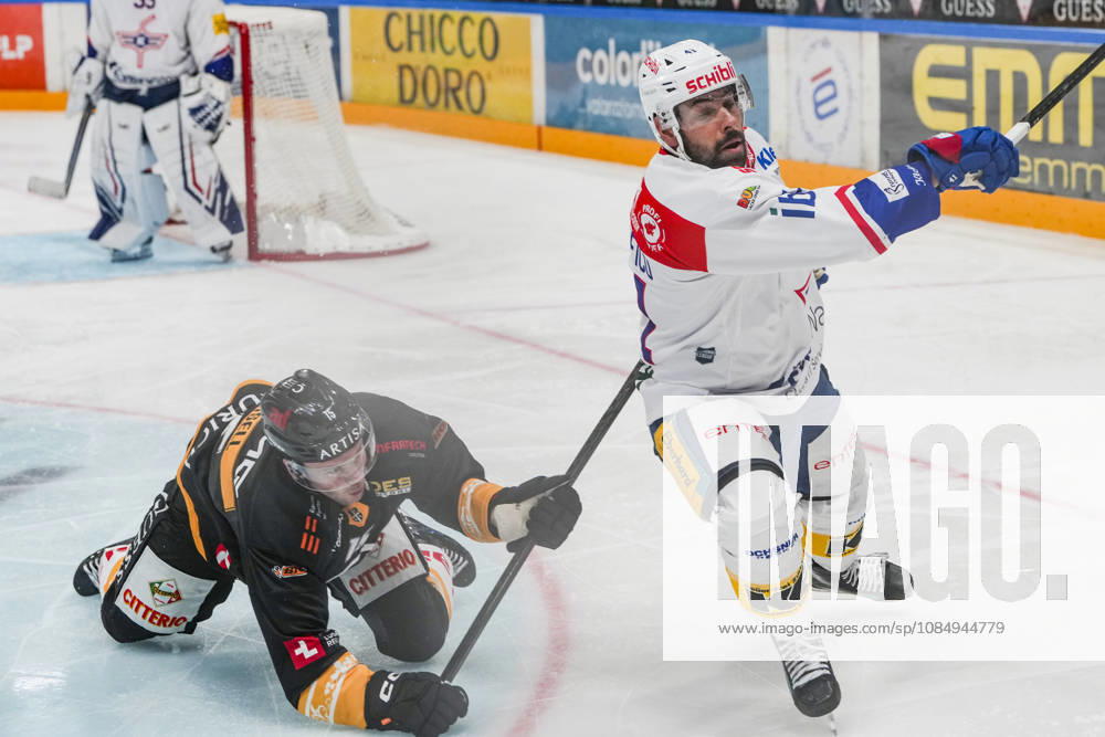 LUGANO, SWITZERLAND, OCTOBER 16: Olle Lycksell of Lugano (L) faces off against Leandro Profico of Kloten (R) during the game between HC Lugano and EHC Kloten at the Corner Arena on October 23, 2026, in Lugano, Switzerland (Lugano, Ticino, Switzerland)