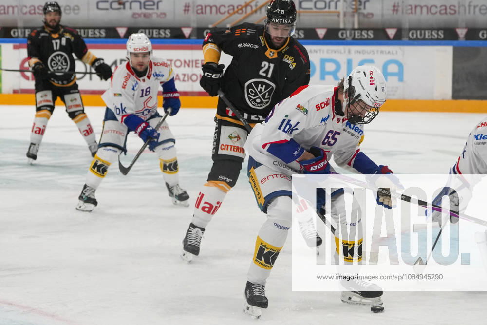 LUGANO, SWITZERLAND, OCTOBER 16: Laurin Rupli of Kloten (R) faces off against Zach Sanford of Lugano (2nd from right) during the game between HC Lugano and EHC Kloten at the Corner Arena on October 23, 2026, in Lugano, Switzerland; Lugano, Ticino, Switzerland