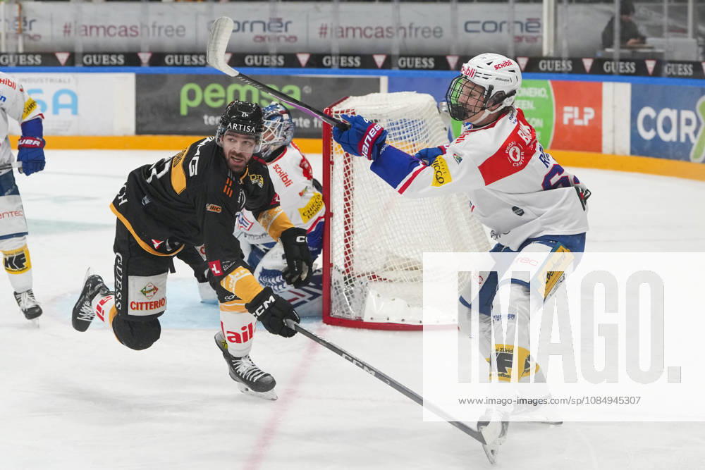 LUGANO, SWITZERLAND, OCTOBER 16: Laurin Rupli of Kloten (R) faces off against Zach Sanford of Lugano (L) during the game between HC Lugano and EHC Kloten at the Corner Arena on October 23, 2026, in Lugano, Switzerland. Lugano, Ticino, Switzerland