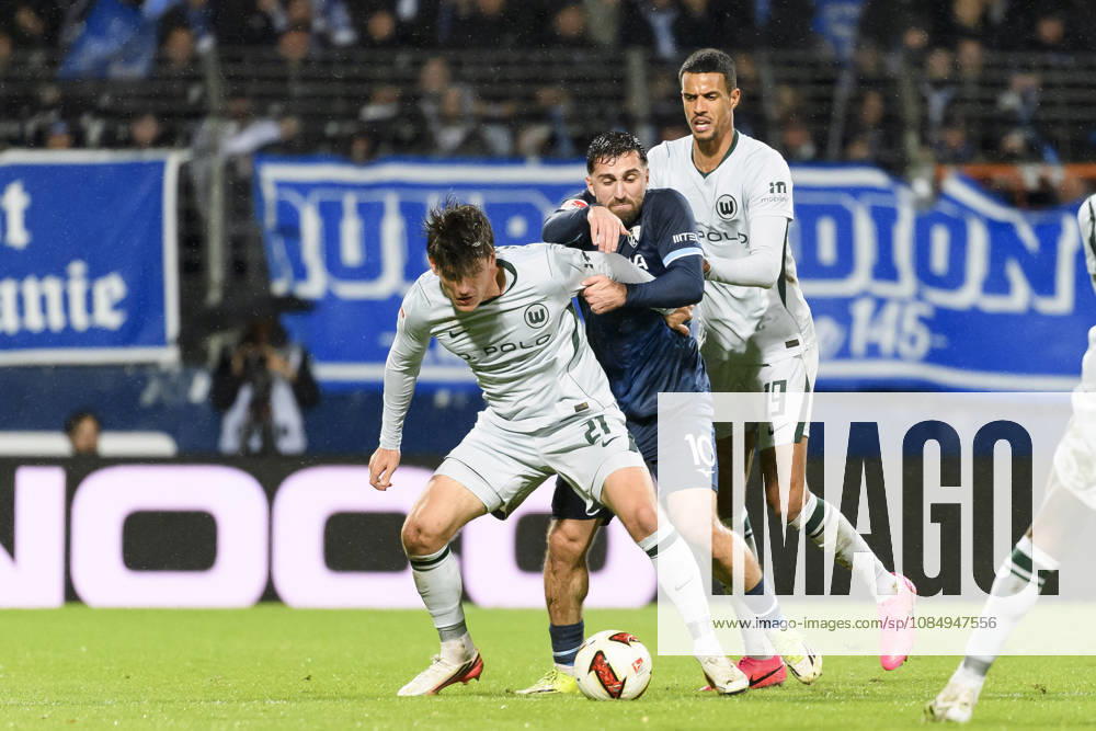 Joakim Maehle of VfL Wolfsburg, Berkan Taz of VfL Bochum, and Robert Glatzel of VfL Wolfsburg battle for the ball during the 2. Bundesliga match between VfL Bochum and VfL Wolfsburg, Vonovia Ruhrstadion on October 23, 2026, in Bochum, Germany. Photo by Max Maiwald, DeFodi Images. Joakim Maehle of VfL Wolfsburg, Berkan Taz of VfL Bochum and Robert Glatzel of VfL Wolfsburg battle for the ball during the 2. Bundesliga match between VfL Bochum and VfL Wolfsburg at Vonovia Ruhrstadion on October 23, 2026 in Bochum, Germany. Photo by Max Maiwald, DeFodi Images. DFB and DFL regulations prohibit any use of photographs as image sequences and or quasi-video. Photo by Max Maiwald, DeFodi Images.