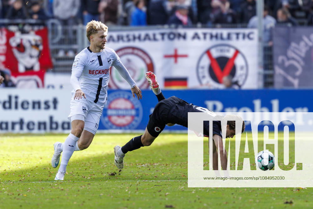 Moritz Kaube (SC Verl, 11) tackling Tim Kloss (Viktoria Köln, 18) during the 3rd division match on gameday 11 between Viktoria Koeln vs. SC verl at the Sportpark Hoehenberg on October 24, 2026 in Koeln, Germany. DFL REGULATIONS PROHIBIT ANY USE OF PHOTOGRAPHS AS IMAGE SEQUENCES AND OR QUASI-VIDEO. Nordrhein-Westfalen Germany