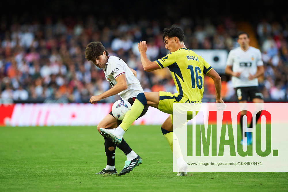 Carlos Macia of Villarreal CF and Javi Guerra of Valencia CF during the LaLiga EA Sports match between Valencia CF and Villarreal CF at Mestalla on October 24, 2026, in Valencia, Spain