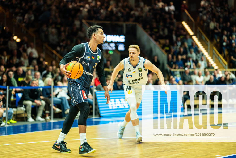 Garai Zeeb (Eisbaeren Bremerhaven), No. 3 with the ball; Lucas Mayer (Hakro Merlins Crailsheim), No. 8 in the background; GER; Hakro Merlins Crailsheim vs. Eisbaeren Bremerhaven; Basketball; 2nd Basketball Bundesliga ProA; Men s; Matchday 6, 2026–2027 season, October 24, 2026, GER, Hakro Merlins Crailsheim vs. Eisbären Bremerhaven, Basketball, 2nd Basketball Bundesliga ProA, Men’s, Matchday 6, 2026–2027 season, October 24, 2026, Ilshofen