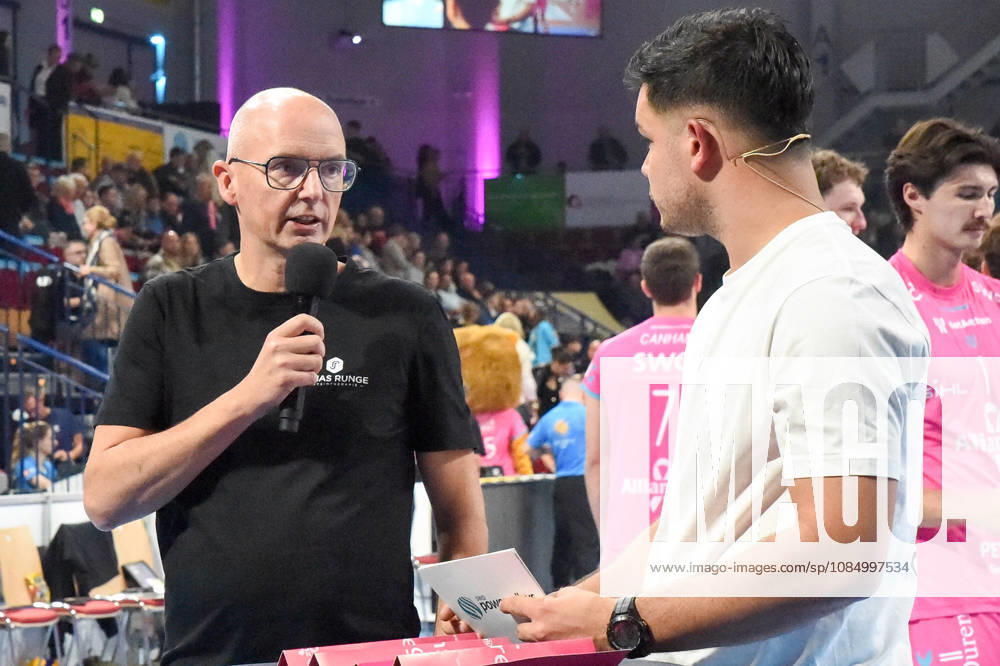 From left: Christophe Achten, Head Coach of the Powervolleys Düren; Philipp Ferebauer, arena announcer, during an interview; TV, television, microphone; October 24, 2026; Düren, Germany; volleyball; Men s Bundesliga 1; regular season; SWD Powervolleys Düren vs. WWK Volleys Munich