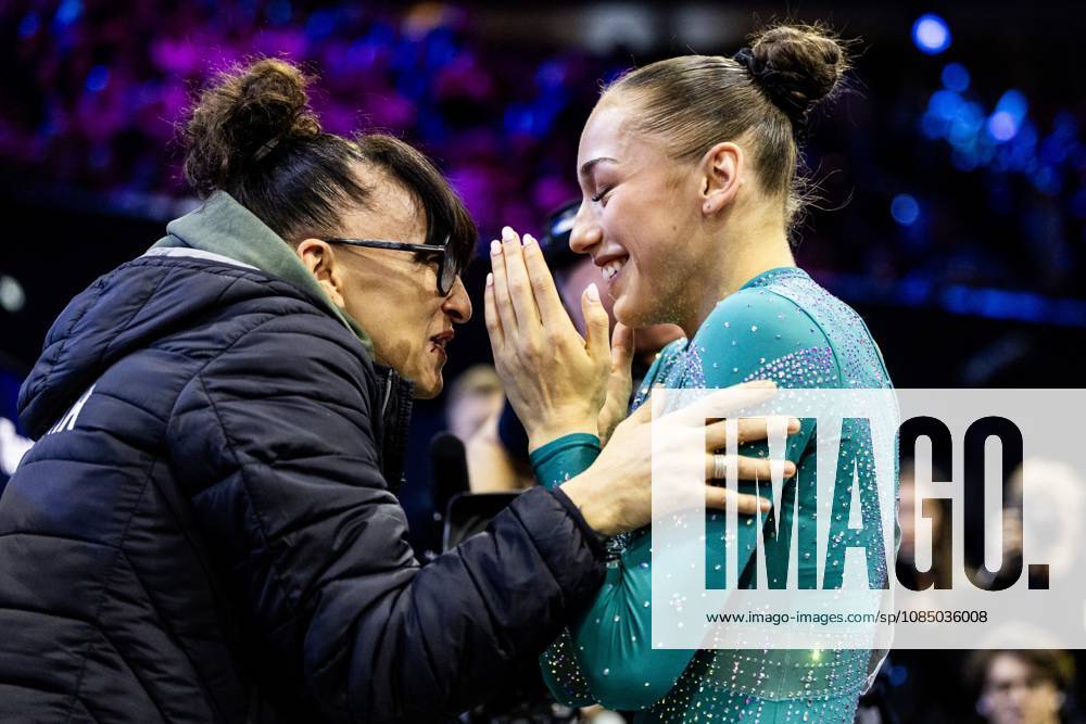 ROTTERDAM - Kaylia Nemour (ALG) receives congratulations after winning the balance beam apparatus final at the World Gymnastics Championships in Rotterdam Ahoy. IRIS VAN DEN BROEK ANP ANPxSportx IVx 573609540 originalFilename: 573609540