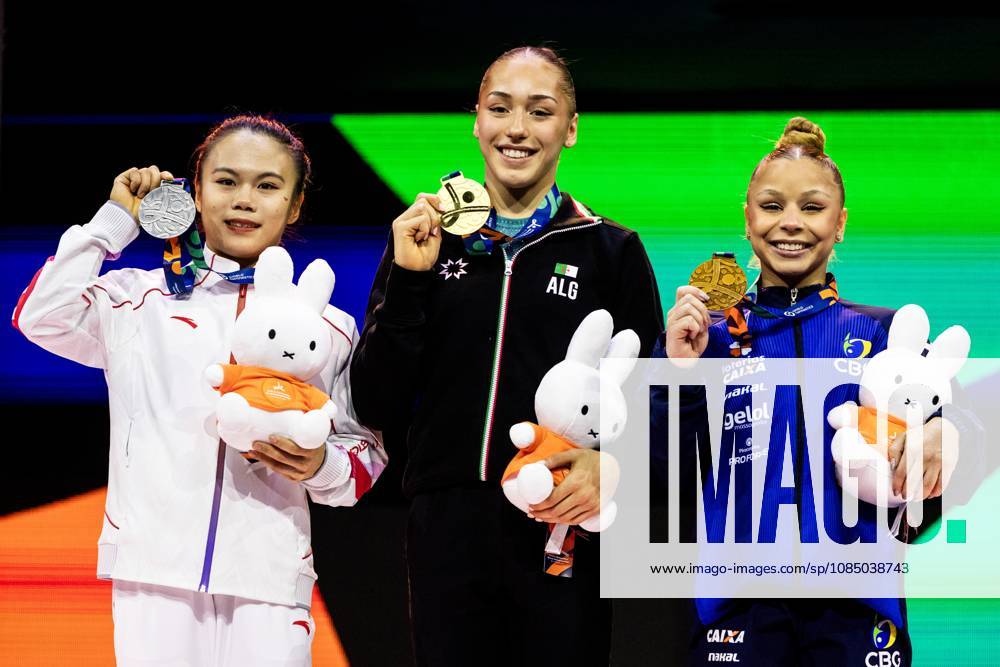 ROTTERDAM - Winner Kaylia Nemour (ALG) surrounded by Qingying Hang (CHN) (l) (second) and Flavia Saraiva (BRA) (third) during the awards ceremony for the balance beam apparatus final at the World Gymnastics Championships in Rotterdam Ahoy. IRIS VAN DEN BROEK ANP ANPxSportx IVx 573613231 originalFilename: 573613231
