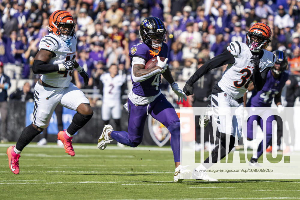 BALTIMORE, MD - OCTOBER 25: Zay Flowers 4 of the Baltimore Ravens runs for a touchdown while being pursued by Barrett Carter 49 of the Cincinnati Bengals and D.J. Ivey 38 of the Cincinnati Bengals during the first quarter of an NFL, American Football Herren, USA football game between the Baltimore Ravens and the Cincinnati Bengals at M&T Bank Stadium on October 25, 2026 in Baltimore, Maryland. (Photo by Ben Hsu Icon Sportswire) NFL: OCT 25 Bengals at Ravens Icon224261025012