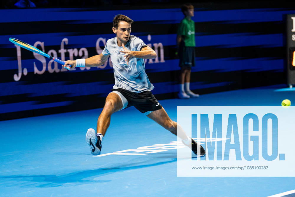 BASEL, SWITZERLAND, OCTOBER 26 Mariano Navone of Argentina stretches to hit a forehand against Valentin Vacherot of Monaco during Day 3 of the Swiss Indoors Basel at St. Jakobshalle on October 26, 2026, in Basel, Switzerland