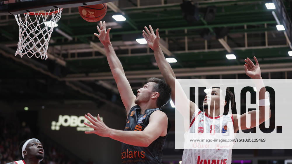 Pictured from left: Charles Thompson of the Würzburg Baskets, 32, and Ryan Mikesell of the NINERS Chemnitz, 33, making a layup against Brandon Tischler of the Würzburg Baskets, 8, on October 26, 2026,Fitness First Würzburg Baskets vs. NINERS Chemnitz, easyCredit BBL, Matchday 6, Germany, 97072, tectake Arena Würzburg,