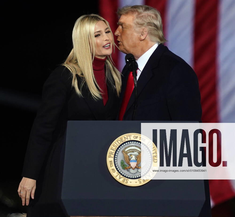 President Donald Trump kisses his daughter Ivanka Trump after introducing her to the the crowd at the Dalton Regional Airport at a Republican rally for Georgia Senators Kelly Loeffler and David Perdue in Dalton, Georgia on Monday, January 4, 2021. ATL20210104113 TAMIxCHAPPELL