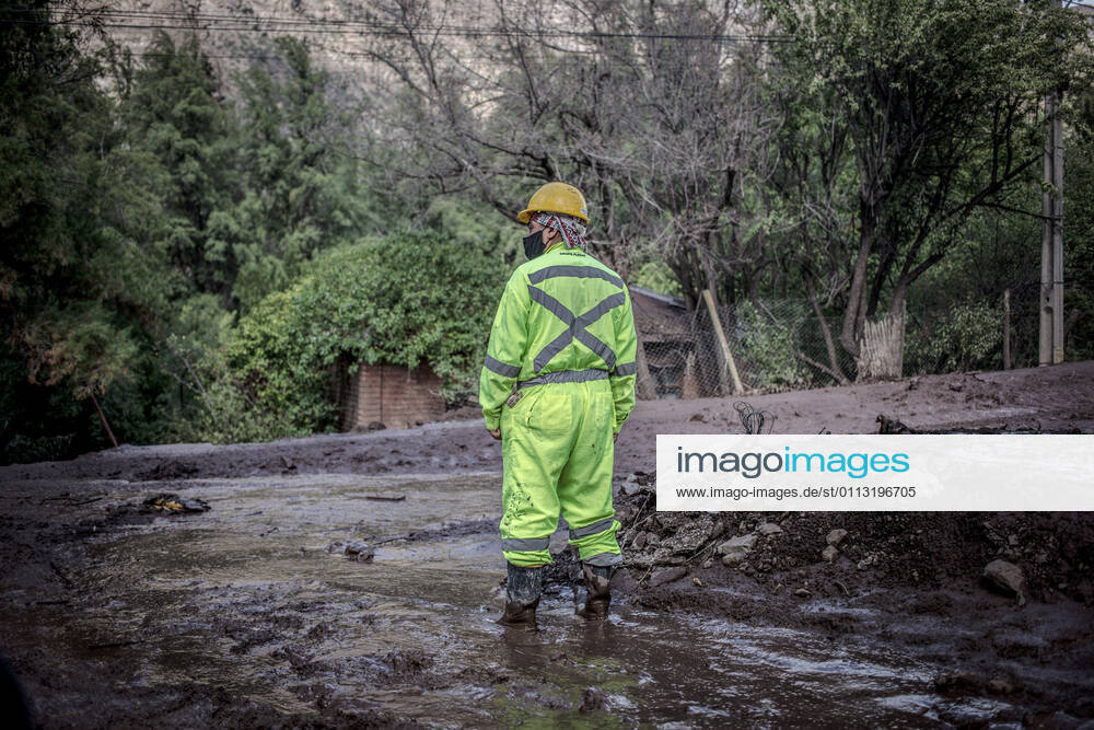 A rescue man seen looking around the road damaged by landslides..Strong frontal system ended with hundred people affected and more than a hundred homes damaged by floods, alluvium and landslides in San Josà de Maipo towns, San Alfonso were one of the sludge most complex area. San José de Maipo Chile - ZUMAs197 20210201_zaa_s197_325