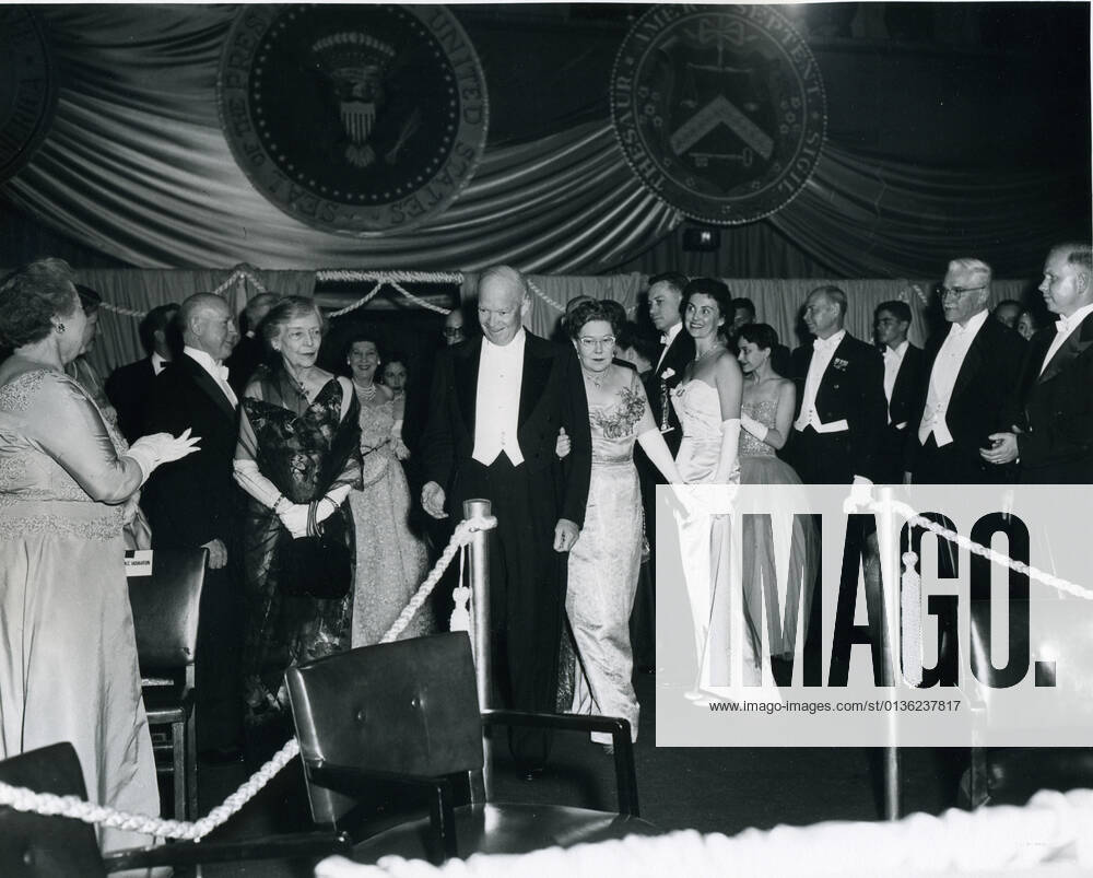 Washington, DC, January 21, 1957 -- Newly-inaugurated President Dwight David Eisenhower enters one of his Inaugural balls. The older woman with white gloves and black wrap to Eisenhower s right is Alice Roosevelt Longworth, daughter of President Theodore Roosevelt. Photo: Abbie Rowe NARA AbbiexRowexCollection 1063_05_Eisenhower Enters One of His Inaugural Balls